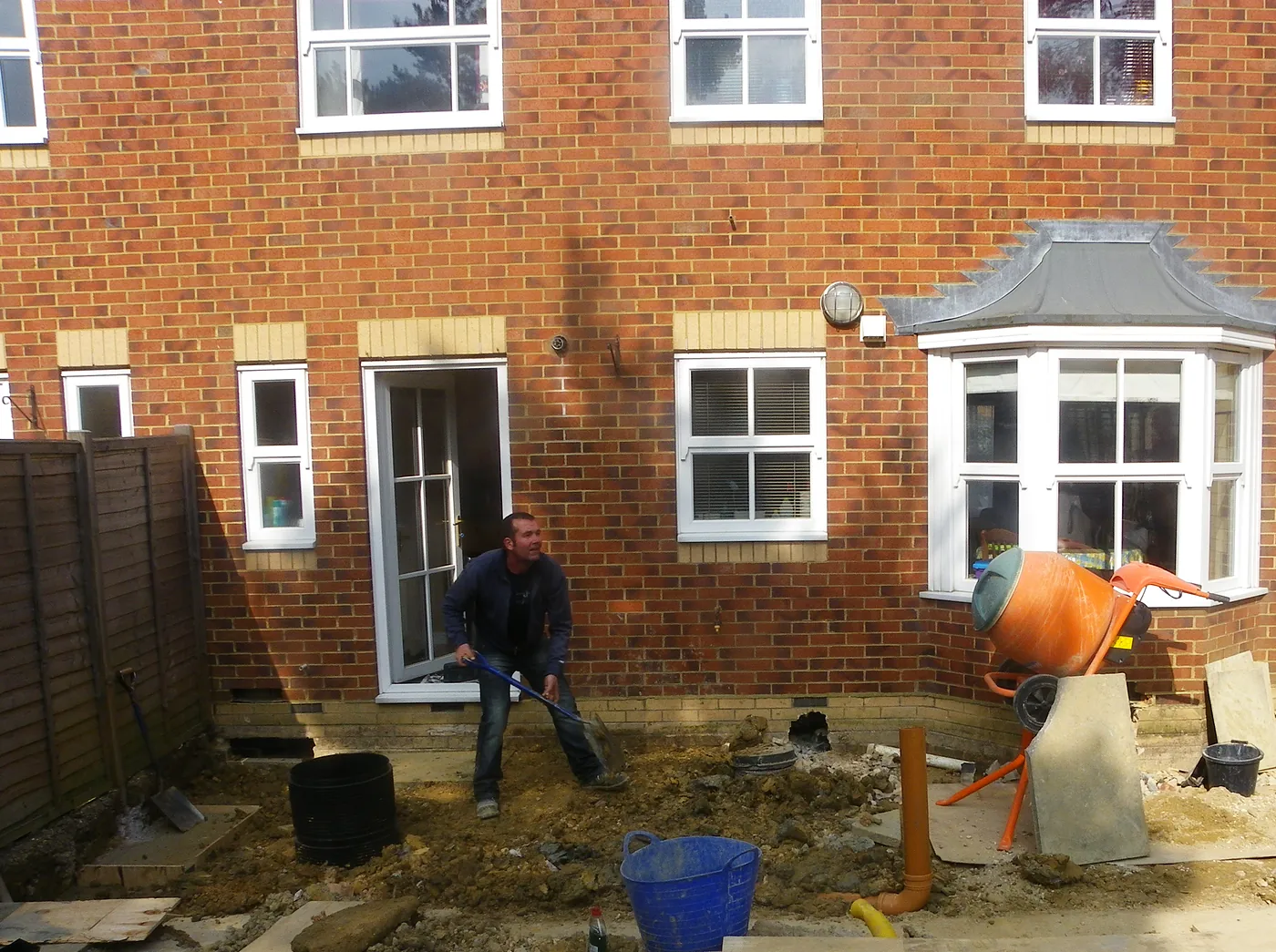 The back of the house before the kitchen extension, with work just starting