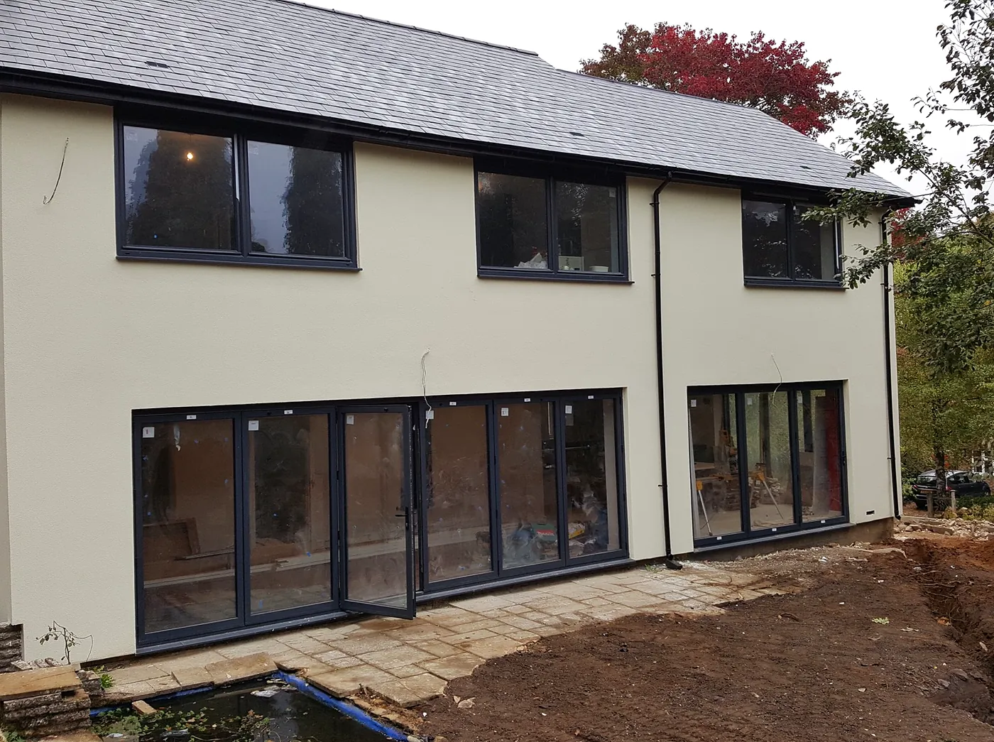 From abandoned 1950s house to five-bedroom family home: render and insulation