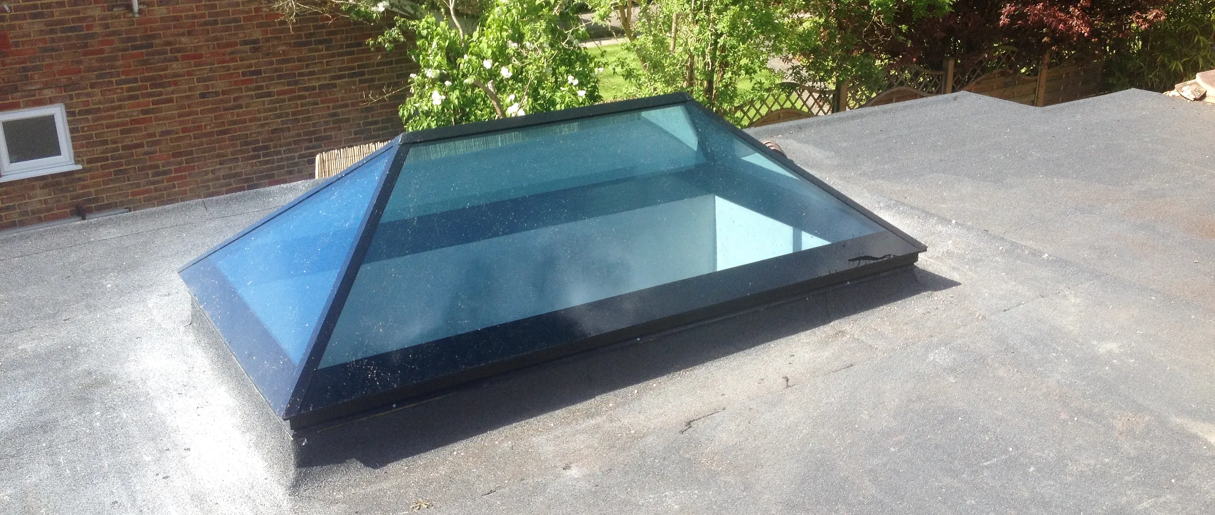 A roof lantern fitted into the flat roof of an extension