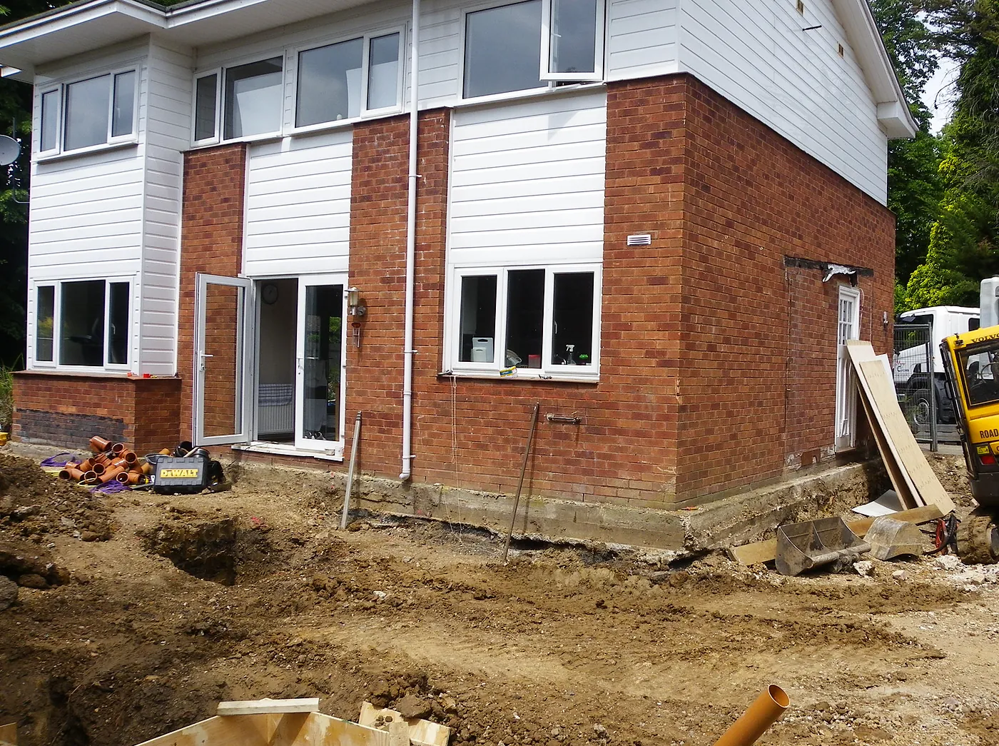 The house before the remodel, with the groundworks just starting