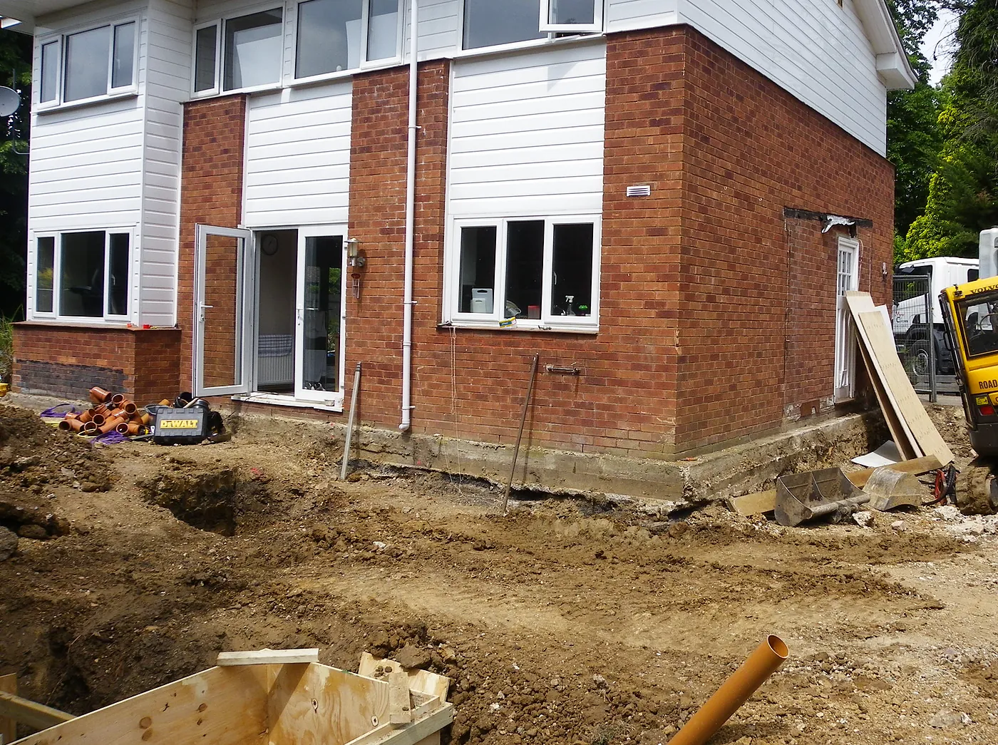 The house before the remodel, with the groundworks just starting